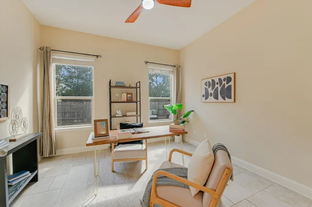 a work room with furniture and a window