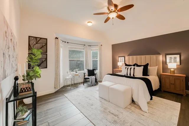 a bedroom with bed and a window