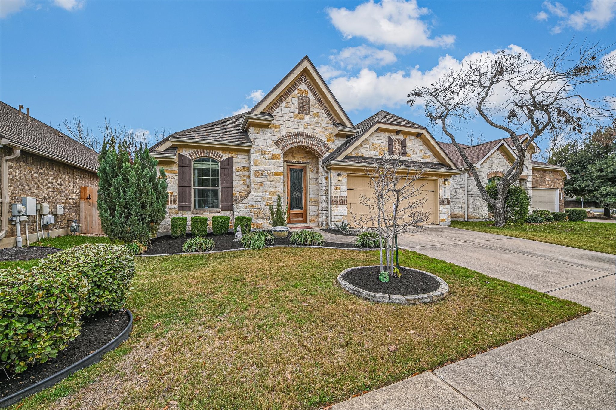 13017 Hymeadow Circle Austin, TX 78729 - Photo 2 of 32 a front view of a house with yard and green space