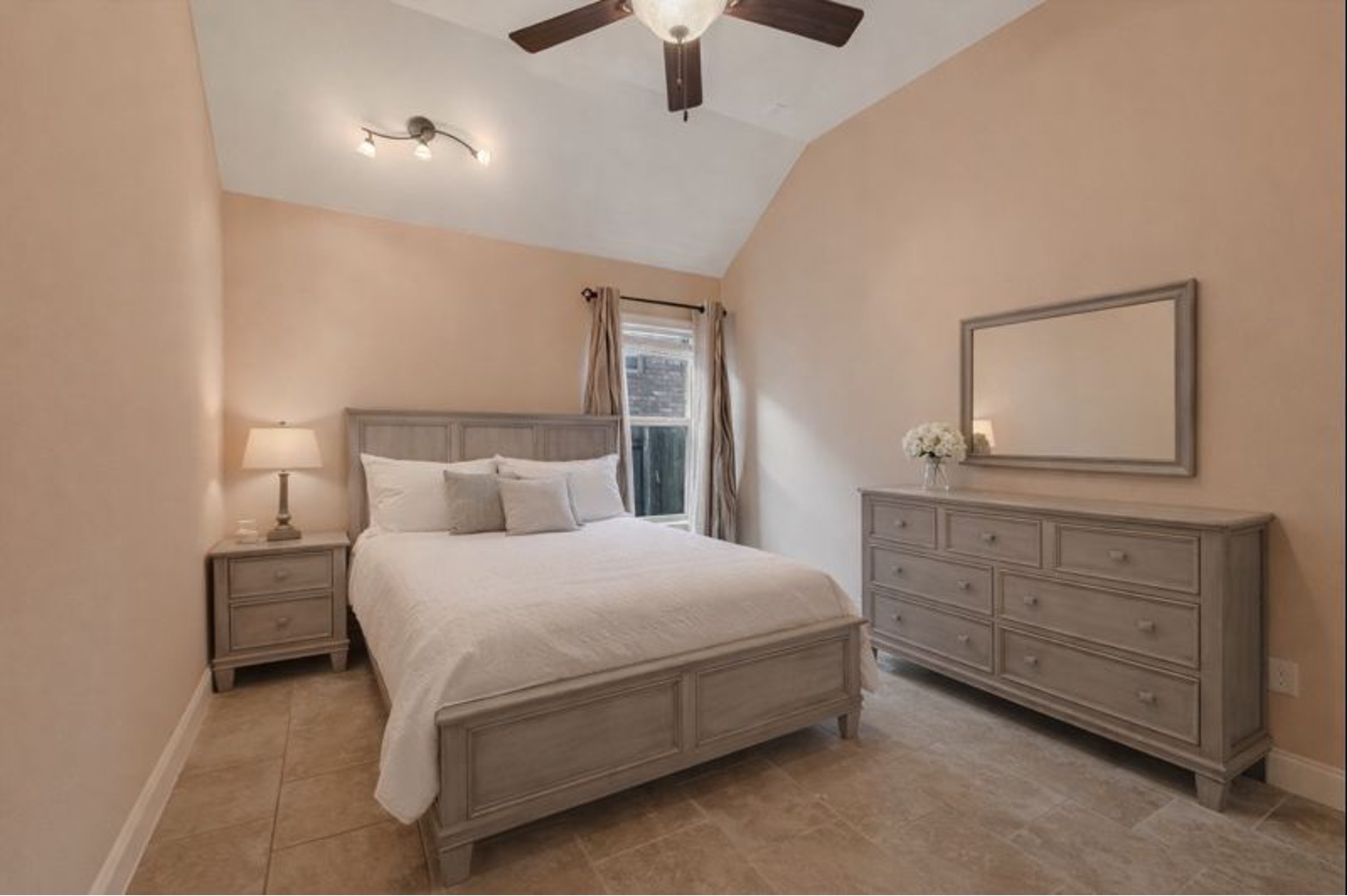 13017 Hymeadow Circle Austin, TX 78729 - Photo 22 of 32 a bedroom with a bed and a dresser in it