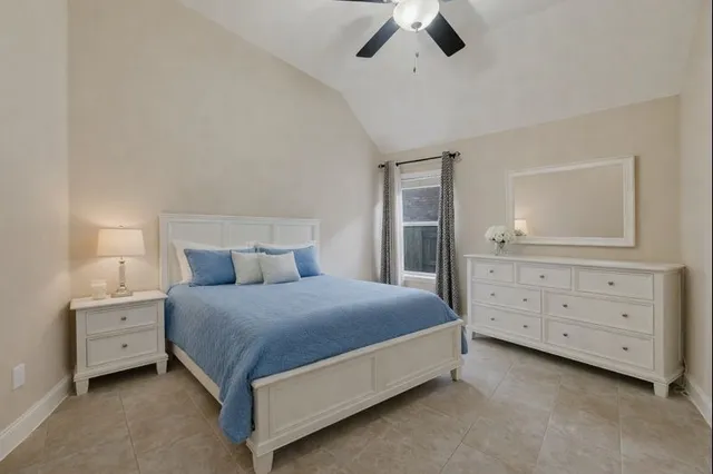 a bedroom with a bed and a dresser