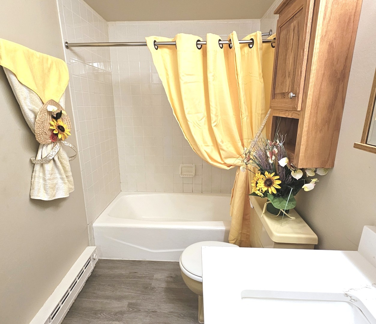 943 North Rohlwing Road, Unit 101H Addison, IL 60101 - Photo 8 of 12 a bathroom with a sink toilet and shower