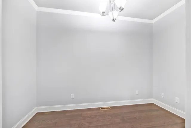 a view of cabinets with wooden floor