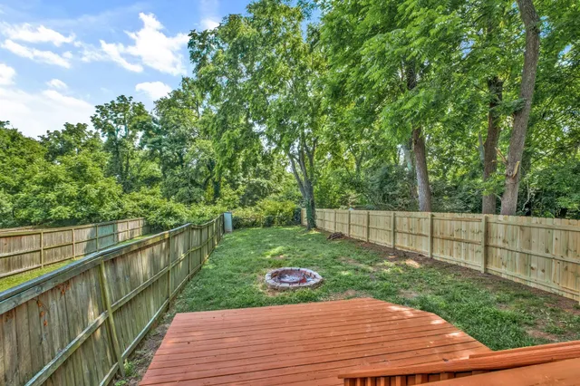 a front view of a house with a yard table and chairs