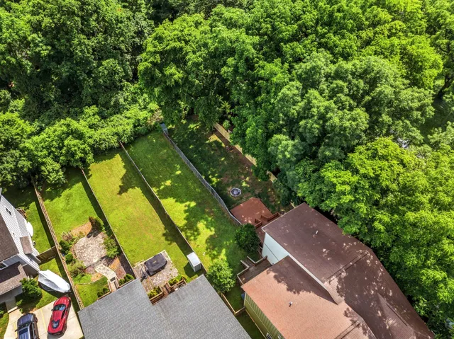 a aerial view of a house with a yard