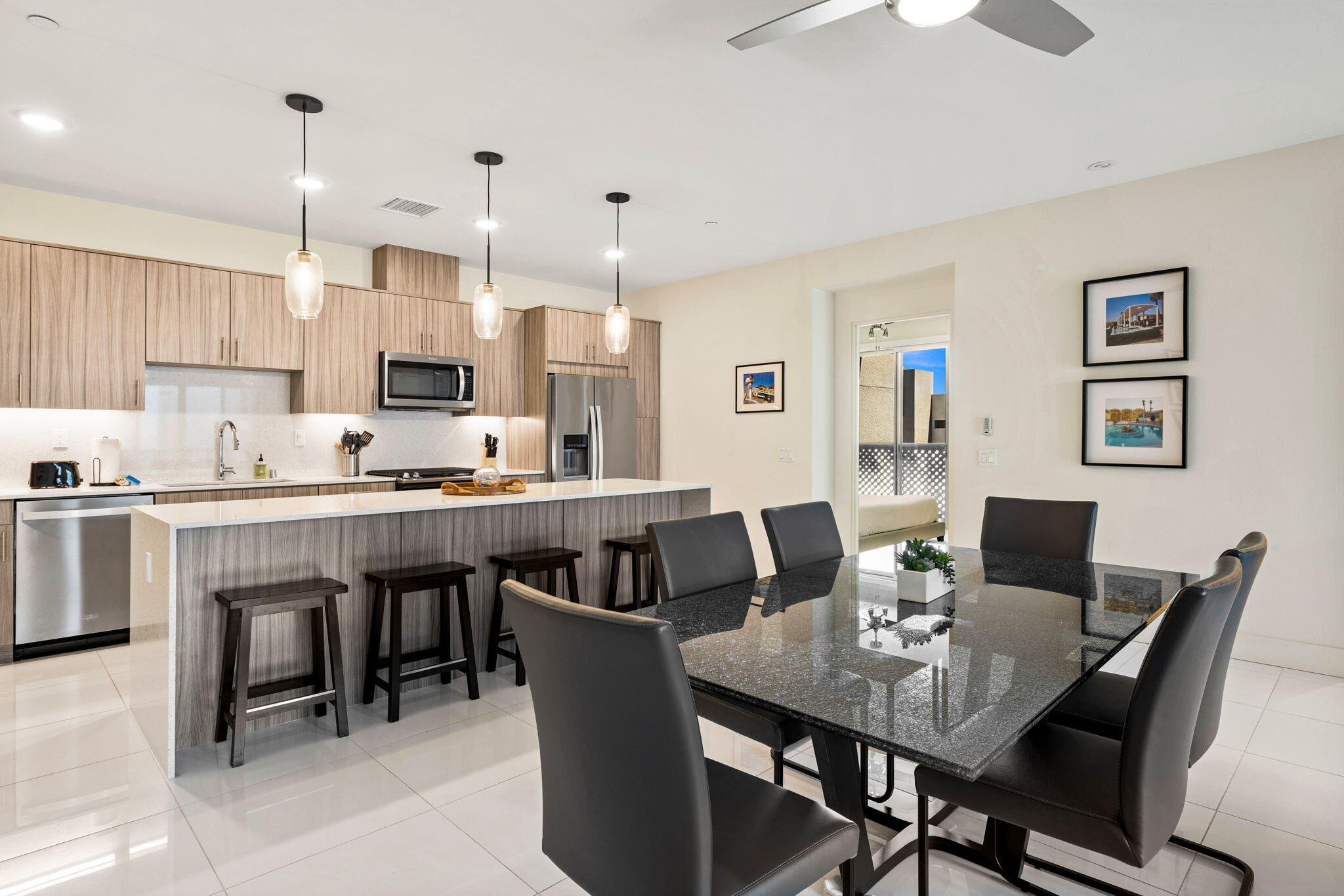 191 The River Palm Springs, CA 92262 - Photo 15 of 39 a view of kitchen with dining table and chairs