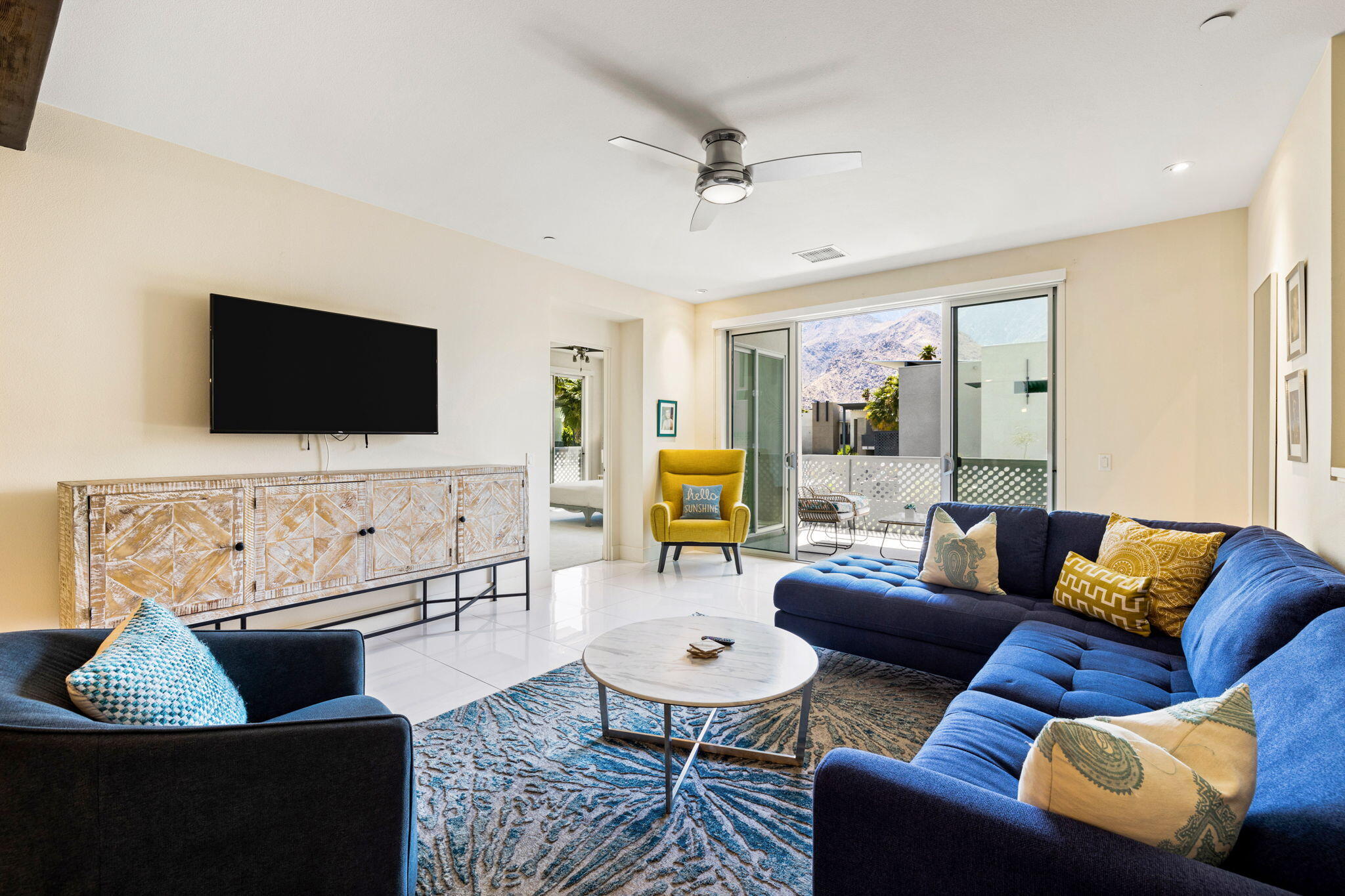 191 The River Palm Springs, CA 92262 - Photo 21 of 39 a living room with furniture and a flat screen tv
