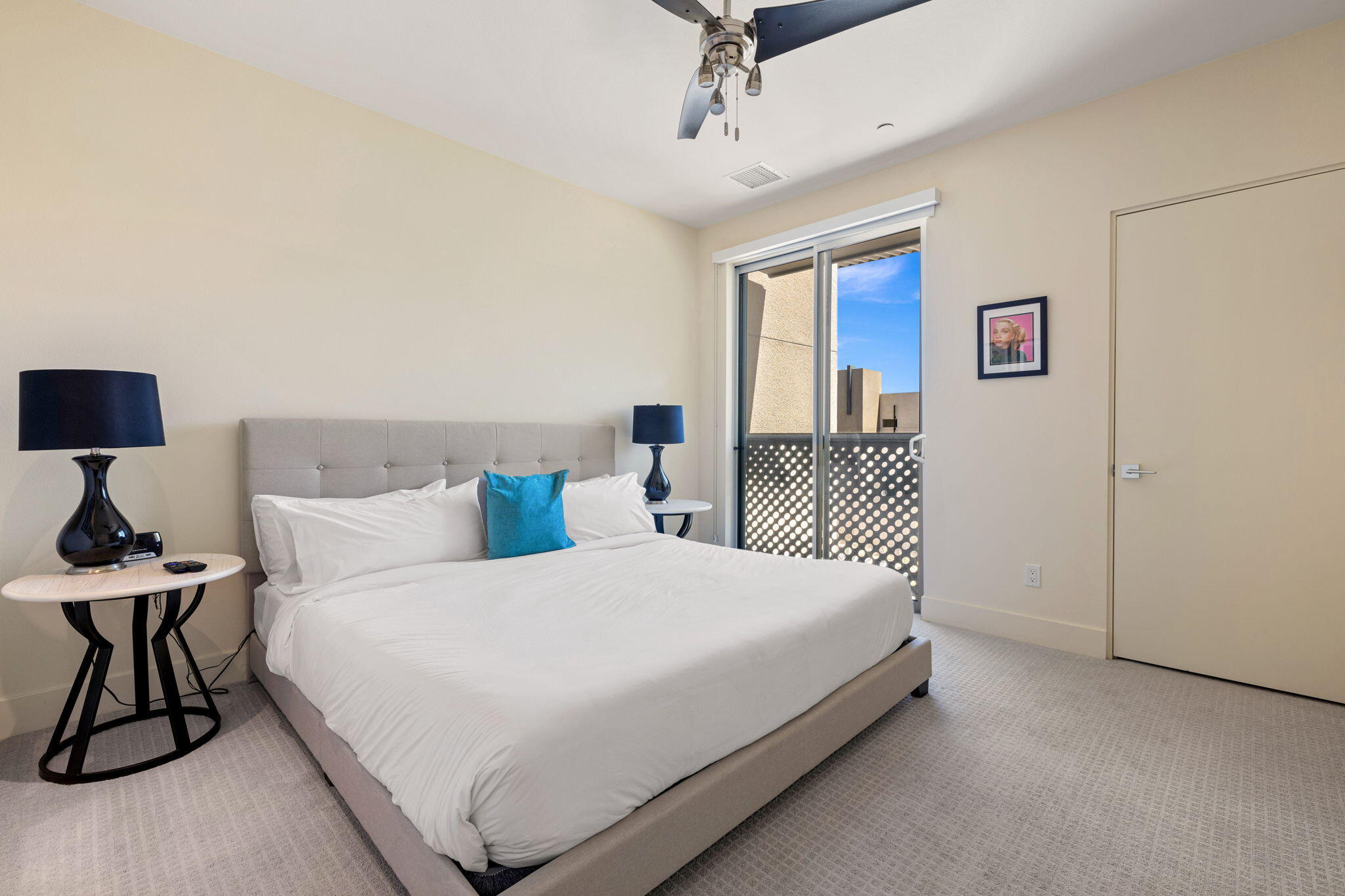 191 The River Palm Springs, CA 92262 - Photo 32 of 39 a bedroom with a bed and a table in it