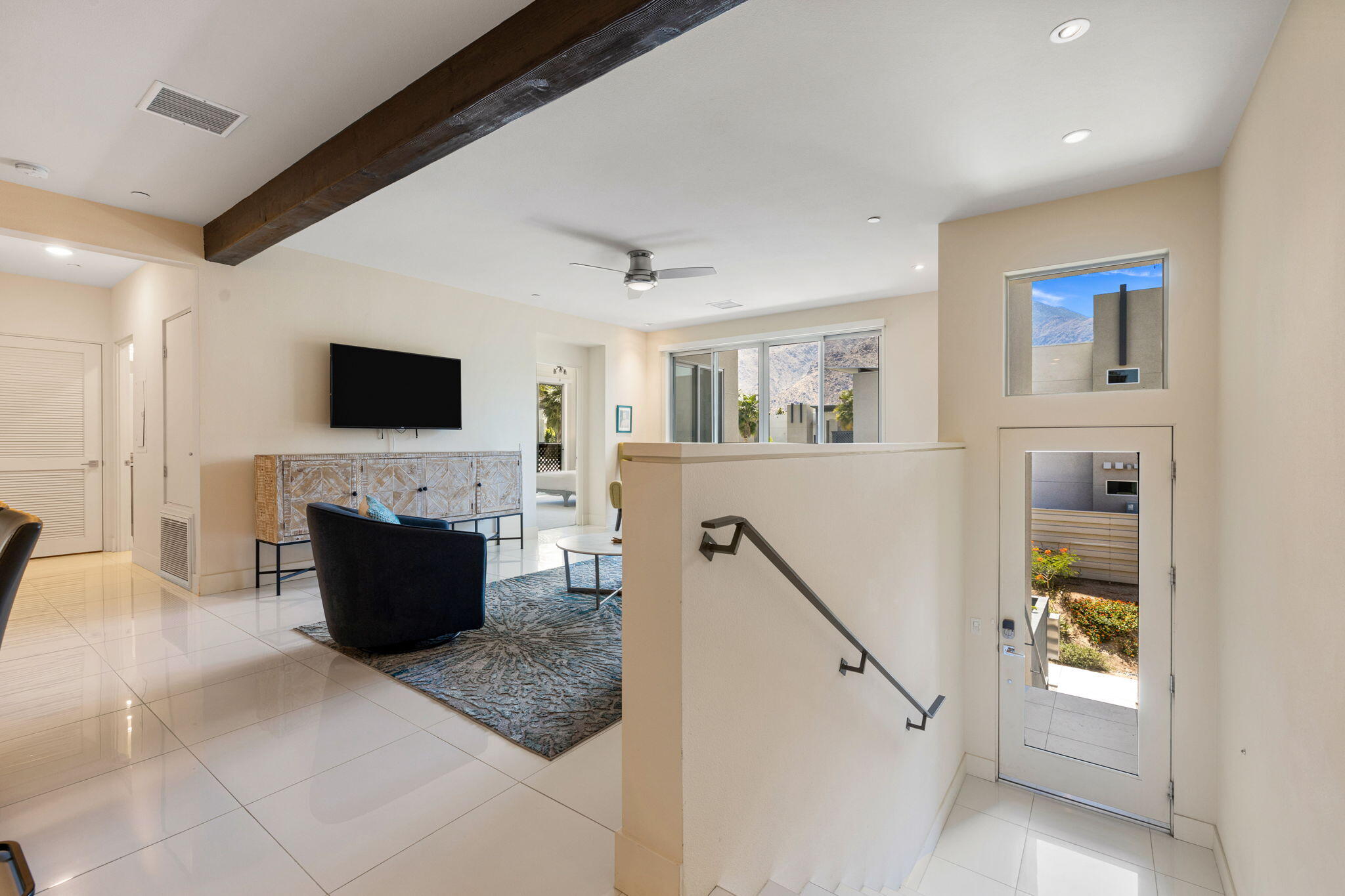 191 The River Palm Springs, CA 92262 - Photo 5 of 39 a living room with furniture and a flat screen tv