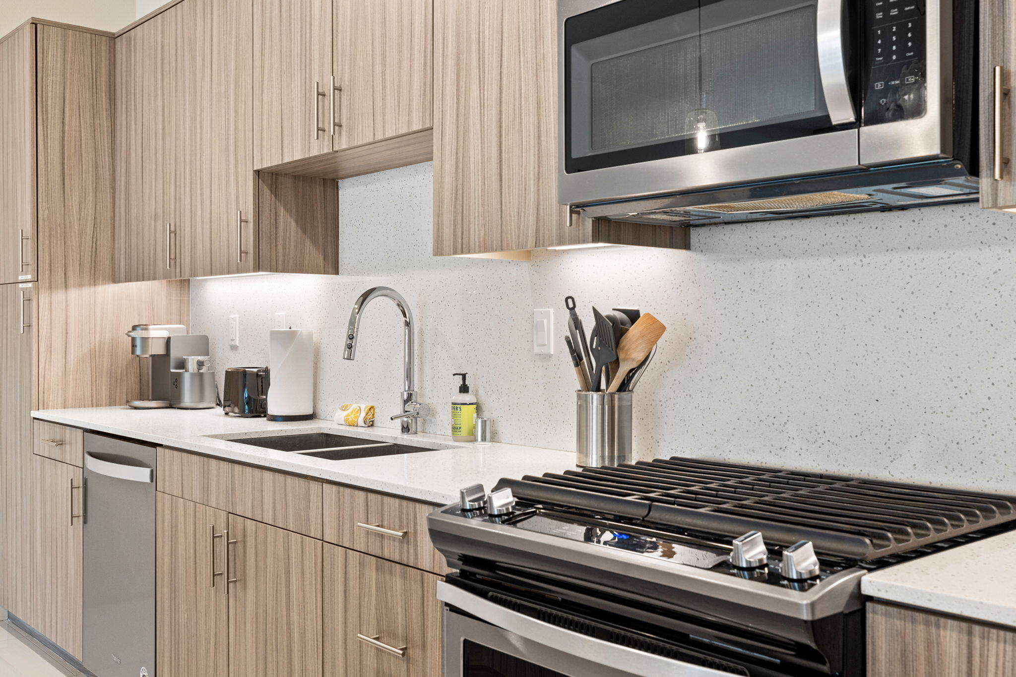 191 The River Palm Springs, CA 92262 - Photo 6 of 39 a kitchen with granite countertop a stove and a sink