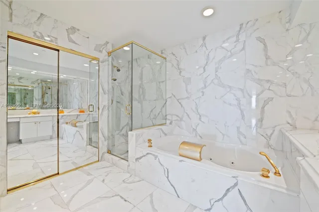 a bathroom with a bathtub and shower