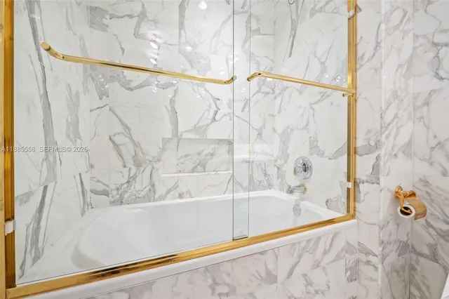 a bathroom with a toilet and shower