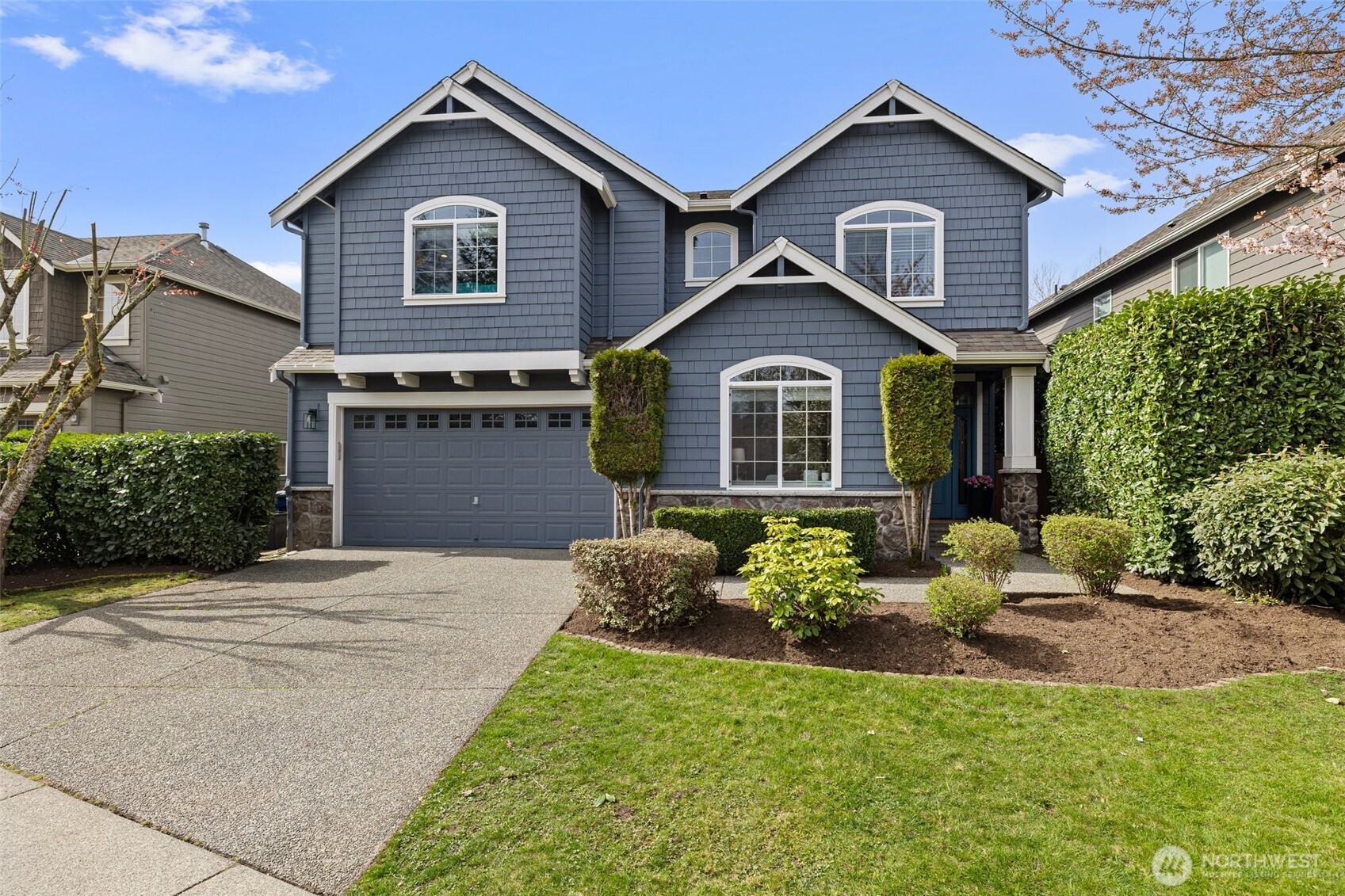 16518 38th Avenue Southeast Bothell, WA 98012 - Photo 1 of 1 a front view of a house with a yard and garage