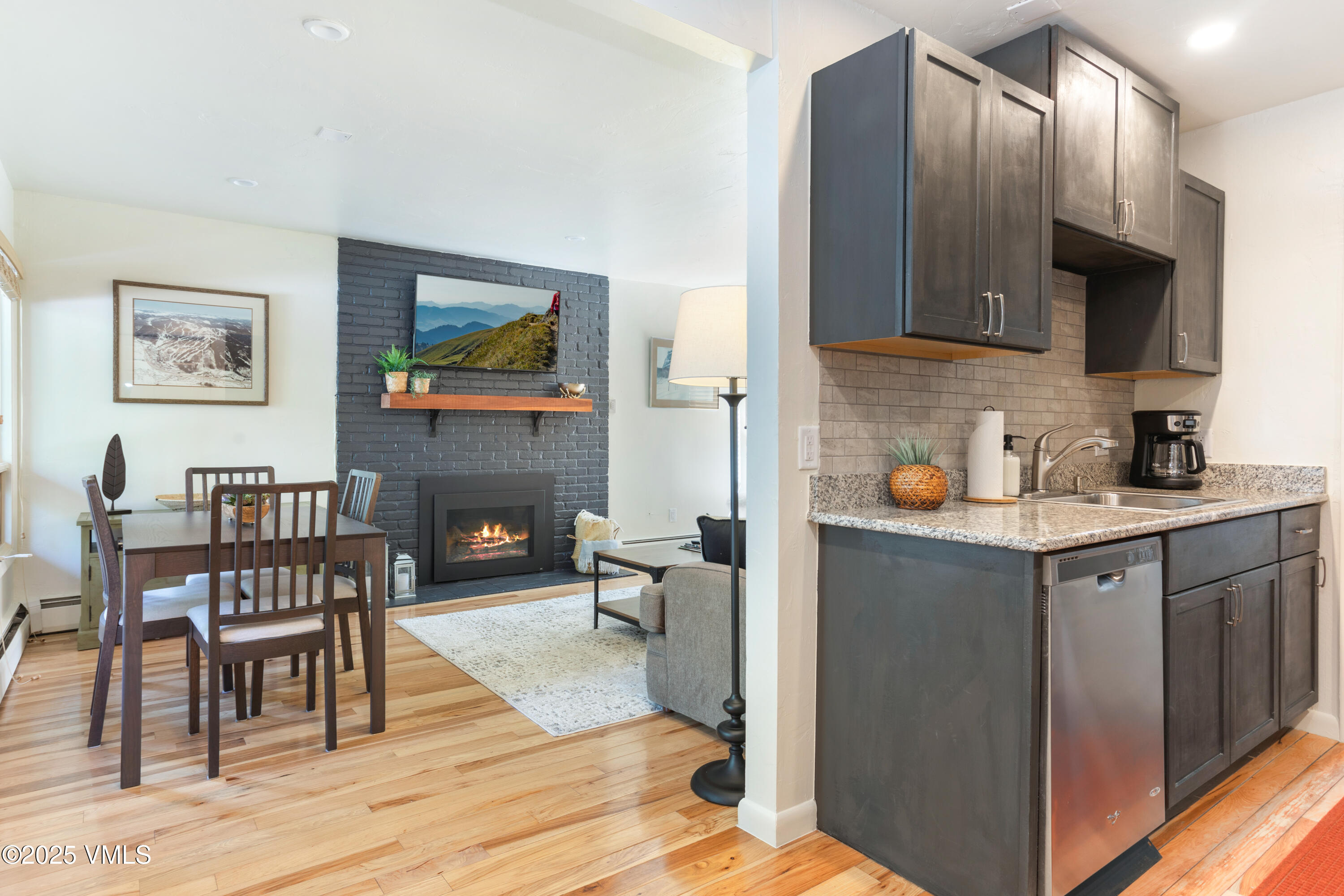 909 Red Sandstone Road, Unit B2 Vail, CO 81657 - Photo 12 of 24 a kitchen with stainless steel appliances granite countertop a refrigerator and a stove top oven
