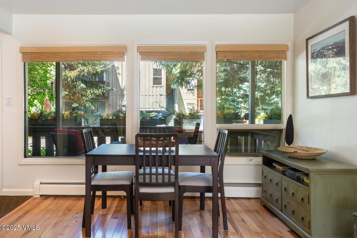 909 Red Sandstone Road, Unit B2 Vail, CO 81657 - Photo 15 of 24 a view of a dining room with furniture window and wooden floor