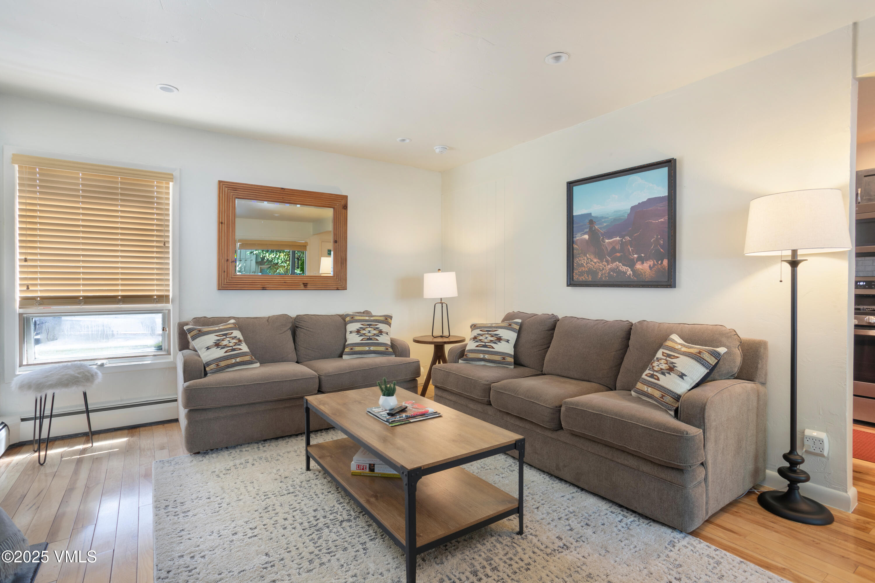 909 Red Sandstone Road, Unit B2 Vail, CO 81657 - Photo 16 of 24 a living room with furniture and a window