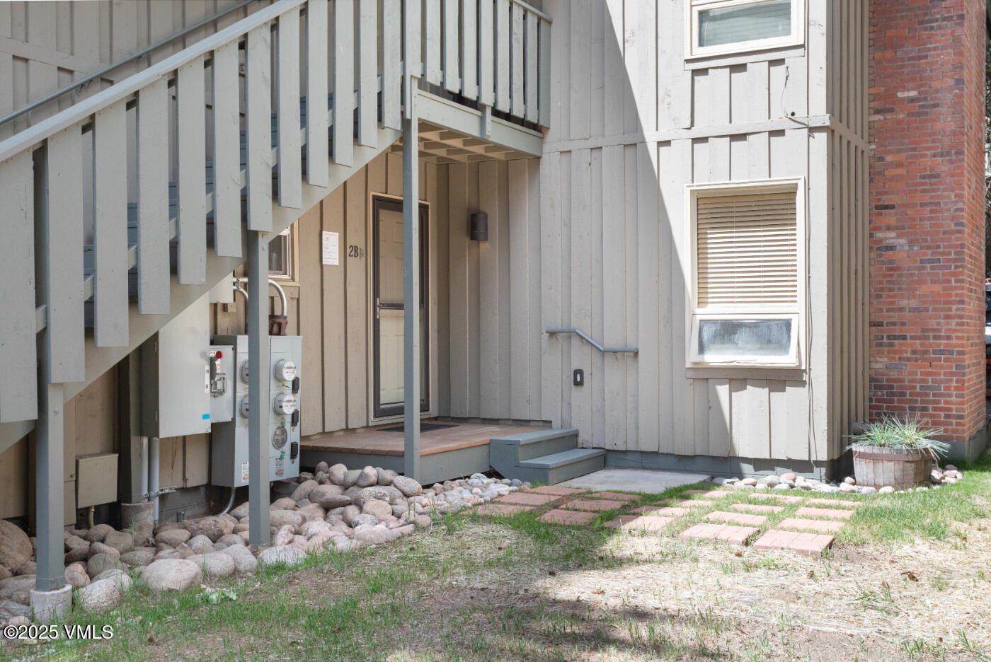 909 Red Sandstone Road, Unit B2 Vail, CO 81657 - Photo 20 of 24 a view of a house with a backyard