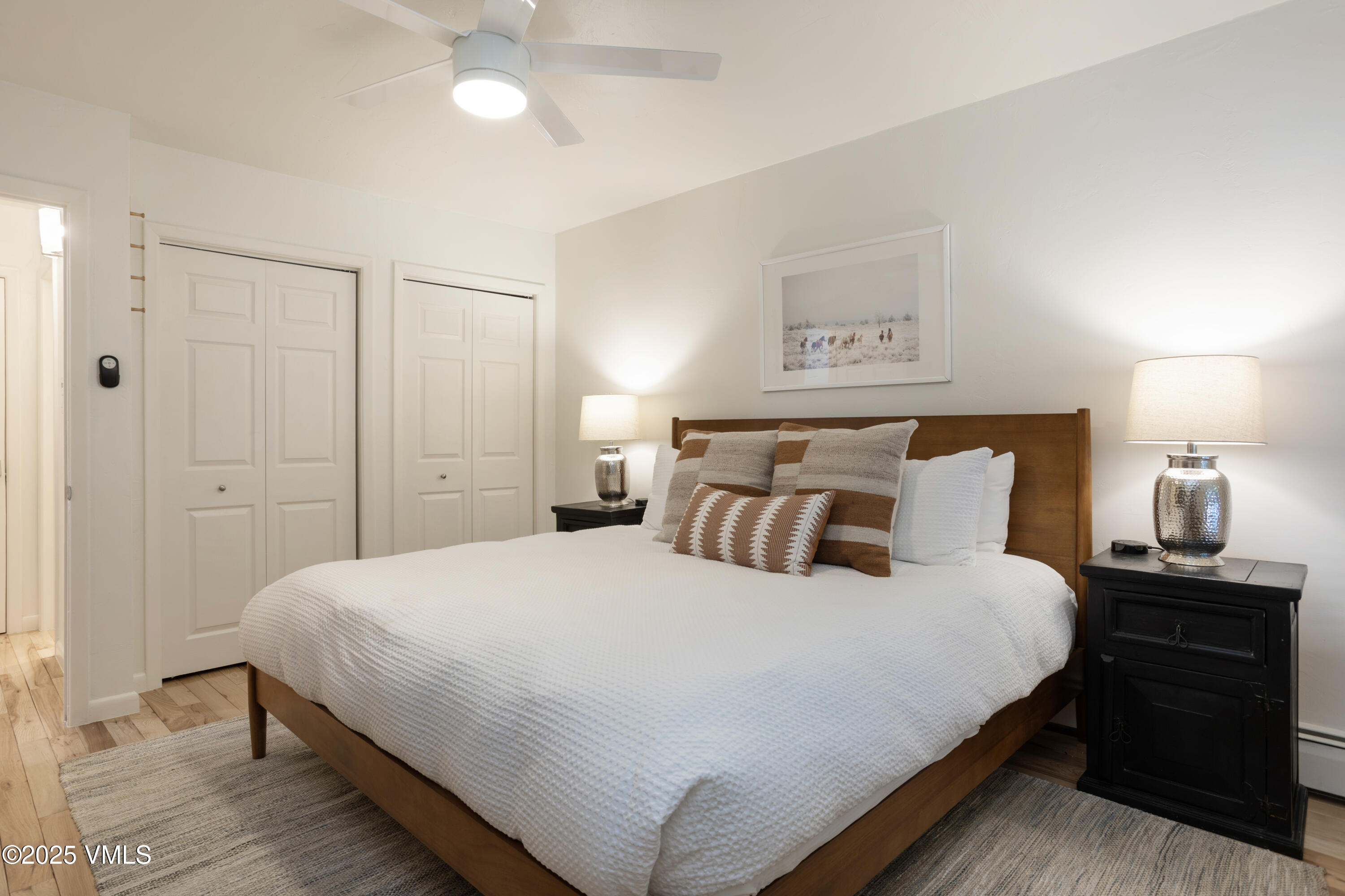 909 Red Sandstone Road, Unit B2 Vail, CO 81657 - Photo 7 of 24 a bedroom with a bed and a lamp