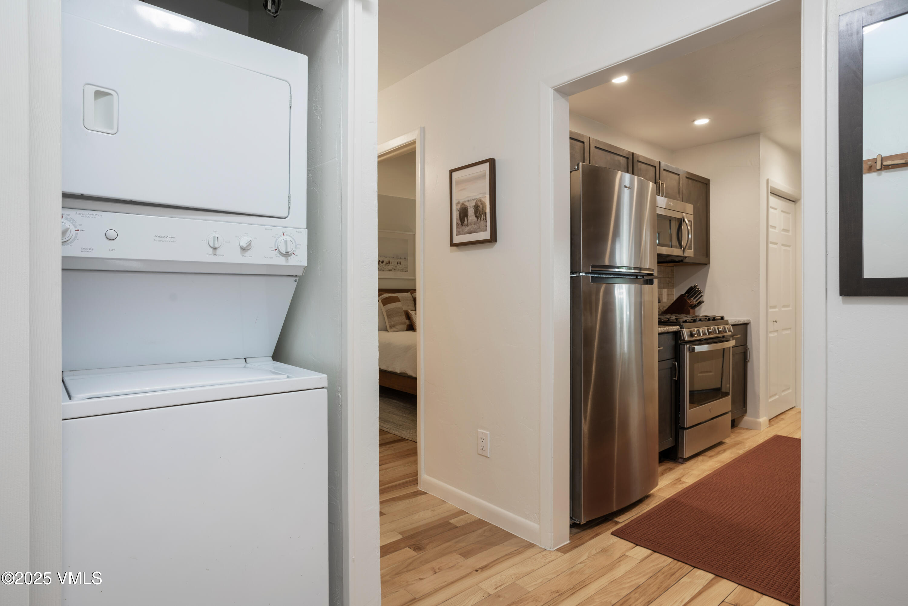 909 Red Sandstone Road, Unit B2 Vail, CO 81657 - Photo 9 of 24 a view of washer and dryer with wooden floor