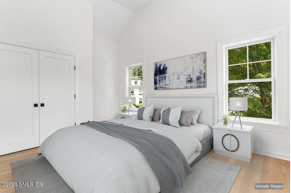 97 Lockwood Road Riverside, CT 06878 - Photo 29 of 59 a bedroom with a bed and a large window