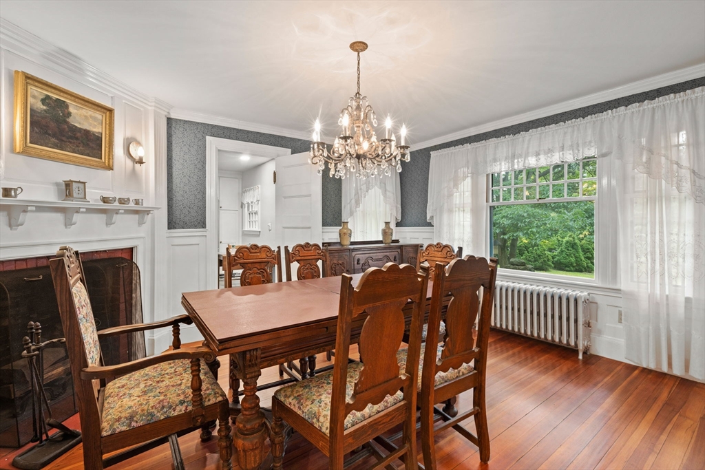 570 Washington Street Dedham, MA 02026 - Photo 11 of 37 a view of a dining room with furniture window and outside view