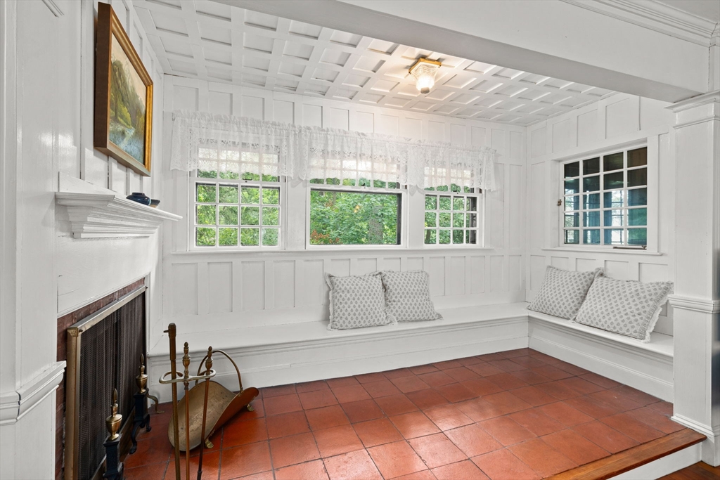 570 Washington Street Dedham, MA 02026 - Photo 18 of 37 a living room with furniture and a fireplace