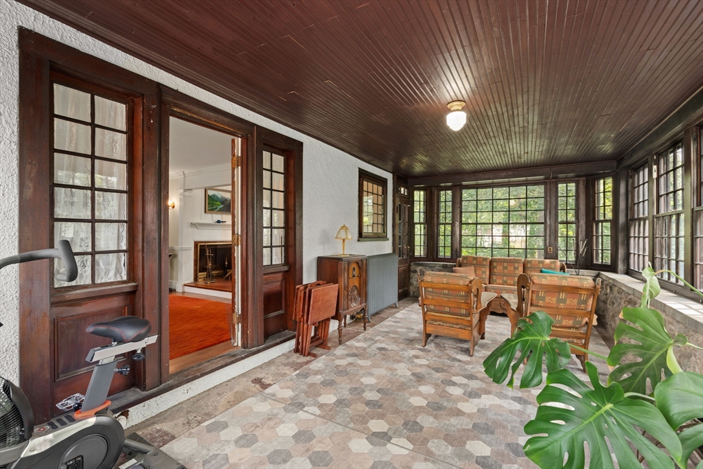 570 Washington Street Dedham, MA 02026 - Photo 19 of 37 a living room with furniture a floor to ceiling window and wooden floor