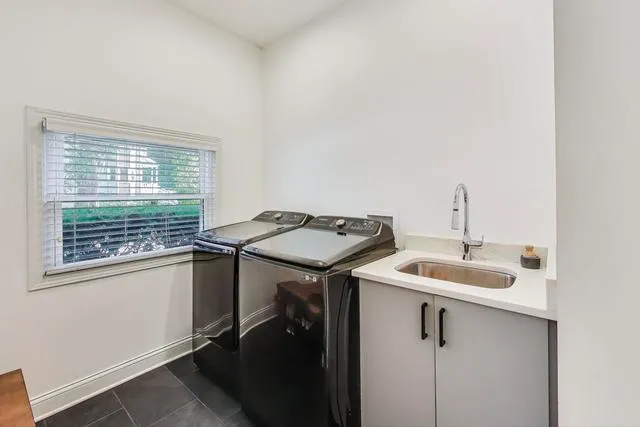 a bathroom with a sink and a window