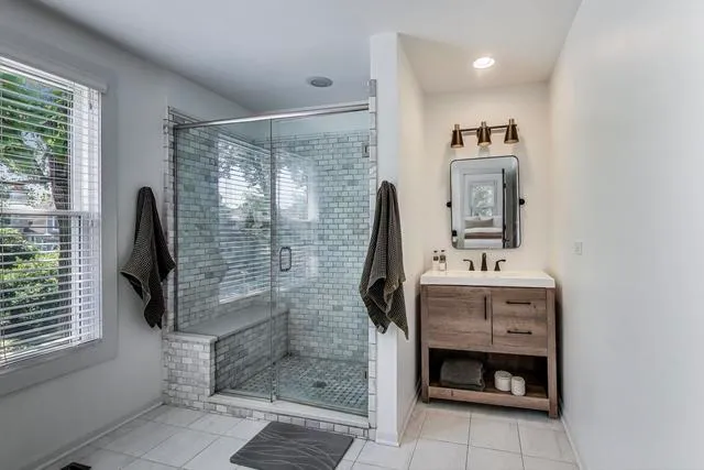 a room that has a bed and a table in it