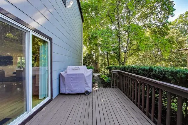 a view of a balcony with wooden floor