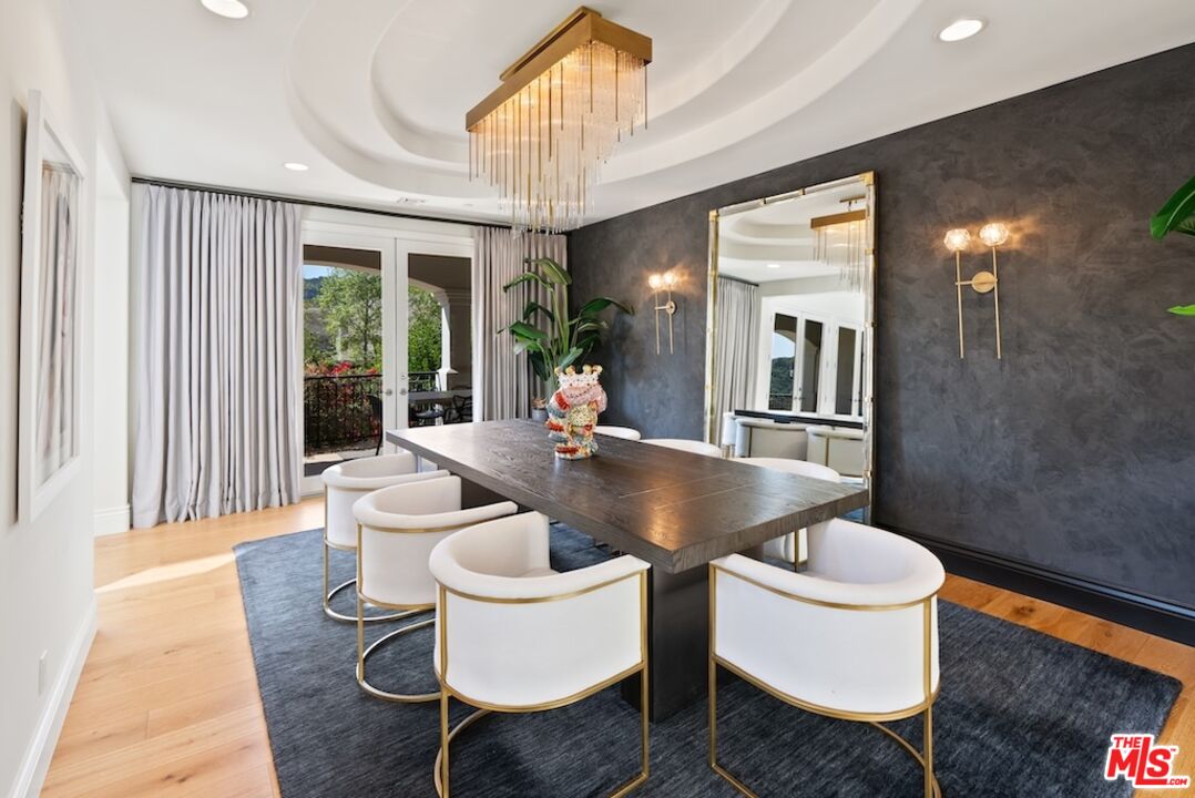 23593 Parksouth Street Calabasas, CA 91302 - Photo 13 of 75 a kitchen with a table and chairs