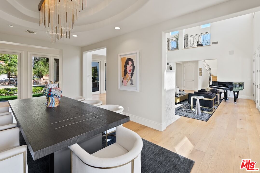 23593 Parksouth Street Calabasas, CA 91302 - Photo 14 of 75 a view of a dining room with furniture and wooden floor