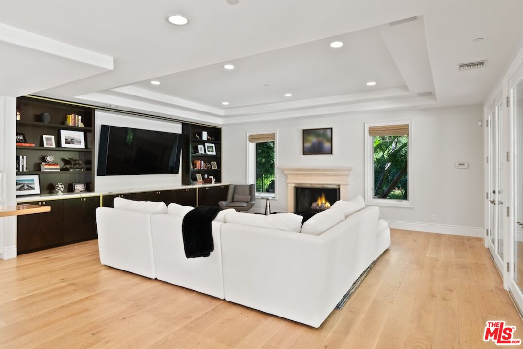 23593 Parksouth Street Calabasas, CA 91302 - Photo 27 of 75 a living room with furniture and a flat screen tv