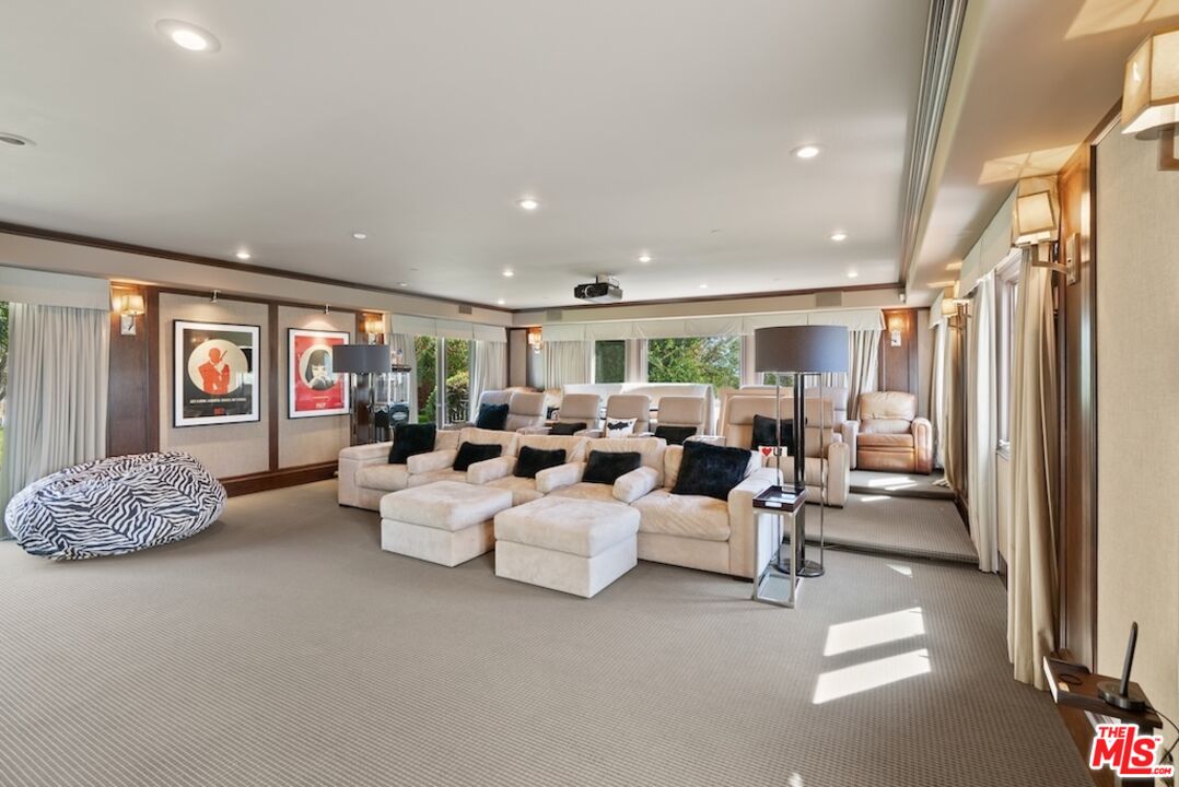 23593 Parksouth Street Calabasas, CA 91302 - Photo 32 of 75 a living room with furniture and a flat screen tv