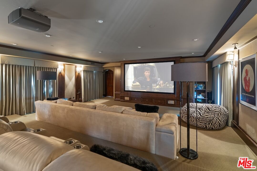 23593 Parksouth Street Calabasas, CA 91302 - Photo 33 of 75 a living room with furniture and a flat screen tv