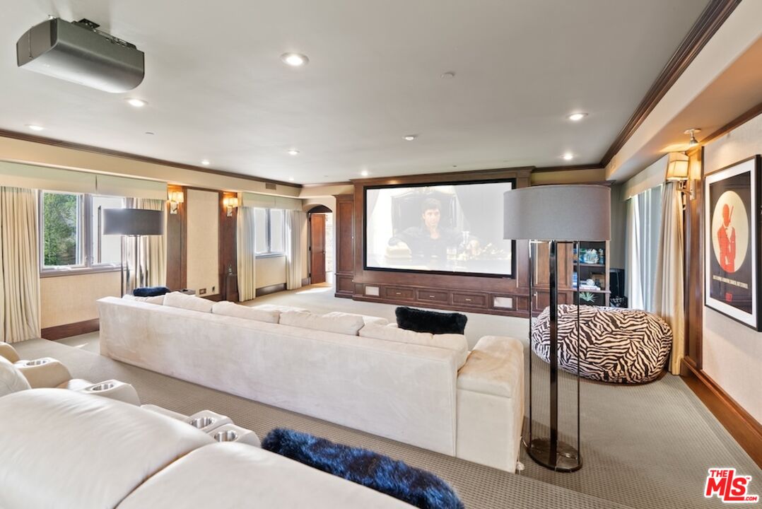 23593 Parksouth Street Calabasas, CA 91302 - Photo 34 of 75 a living room with furniture and a flat screen tv