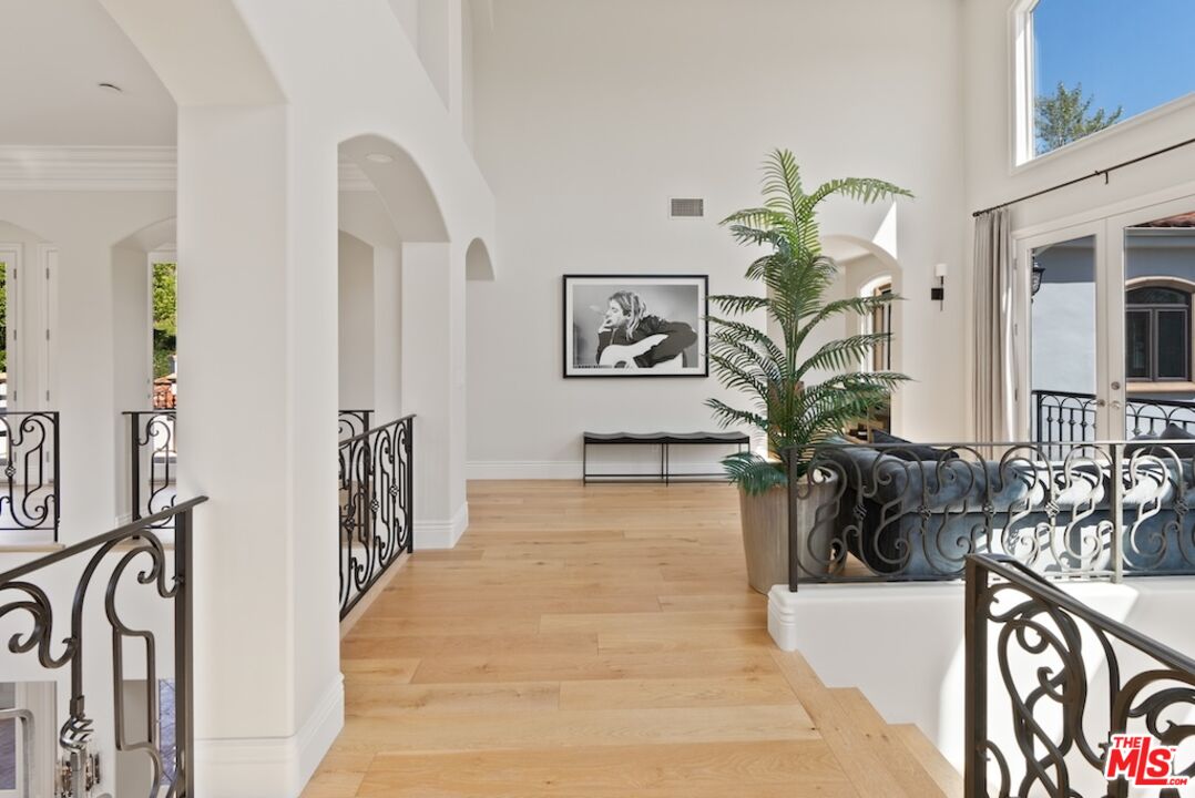 23593 Parksouth Street Calabasas, CA 91302 - Photo 35 of 75 a view of a hallway with furniture and a potted plant