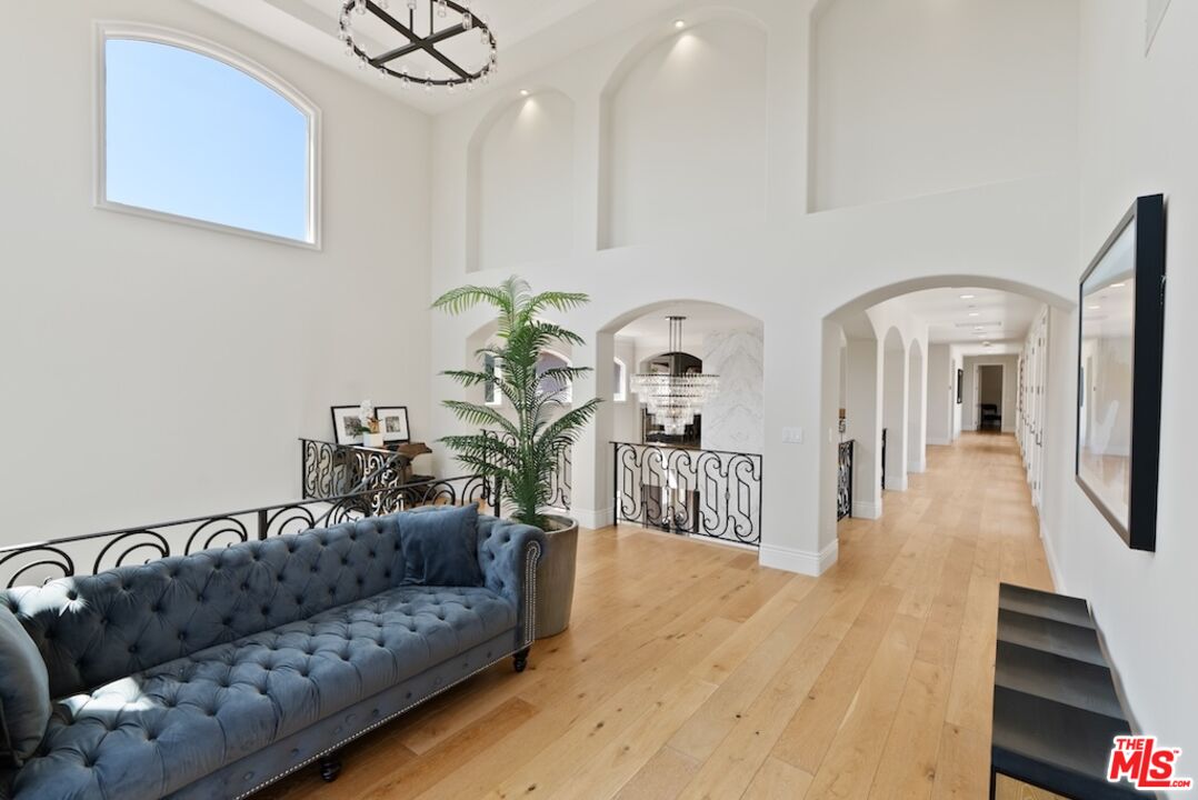 23593 Parksouth Street Calabasas, CA 91302 - Photo 37 of 75 a living room with furniture and a wooden floor
