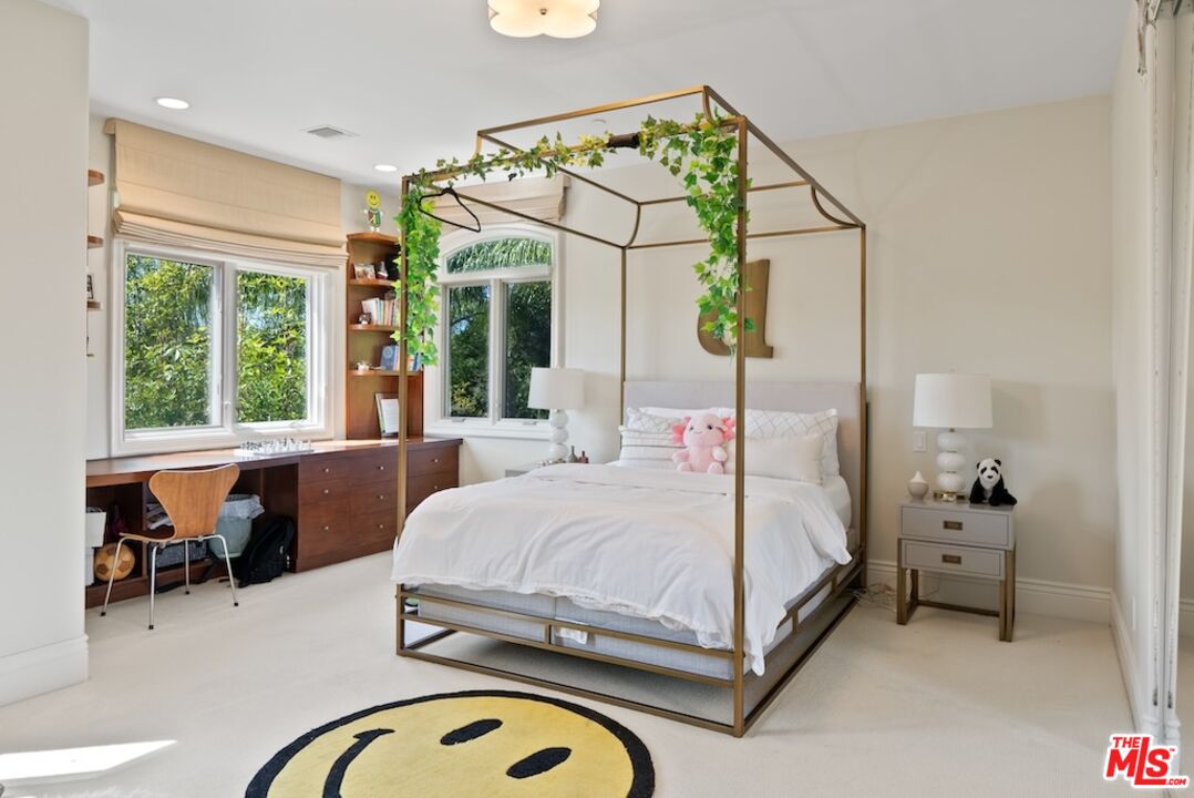 23593 Parksouth Street Calabasas, CA 91302 - Photo 55 of 75 a bedroom with a bed and a mirror