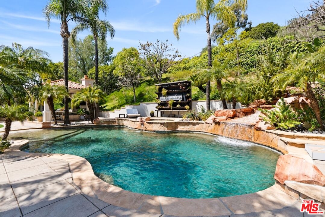 23593 Parksouth Street Calabasas, CA 91302 - Photo 58 of 75 a view of a swimming pool with a patio