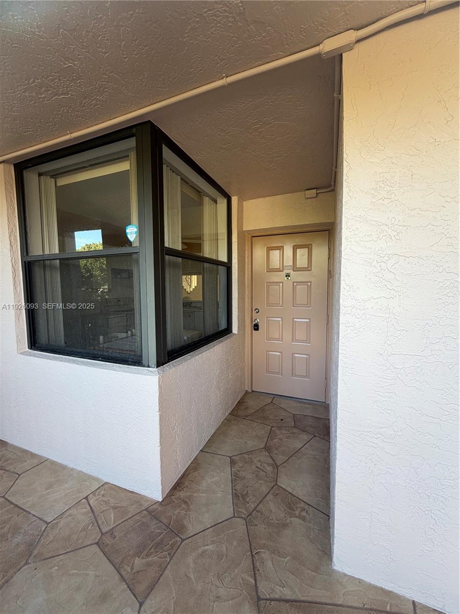 10360 Northwest 30th Court, Unit 204 Sunrise, FL 33322 - Photo 12 of 24 a view of a front door of a house