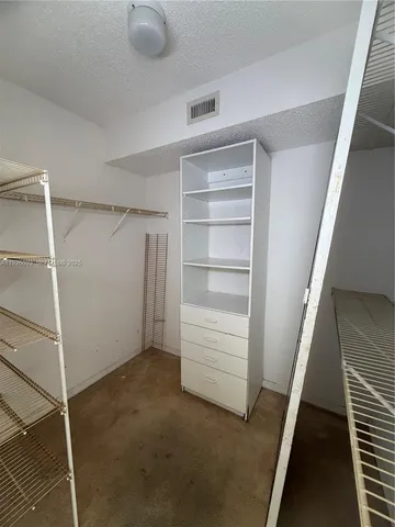 a view of an empty walk in closet
