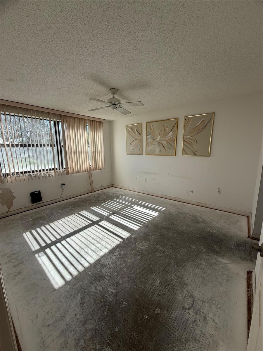 10360 Northwest 30th Court, Unit 204 Sunrise, FL 33322 - Photo 23 of 24 an empty room with windows