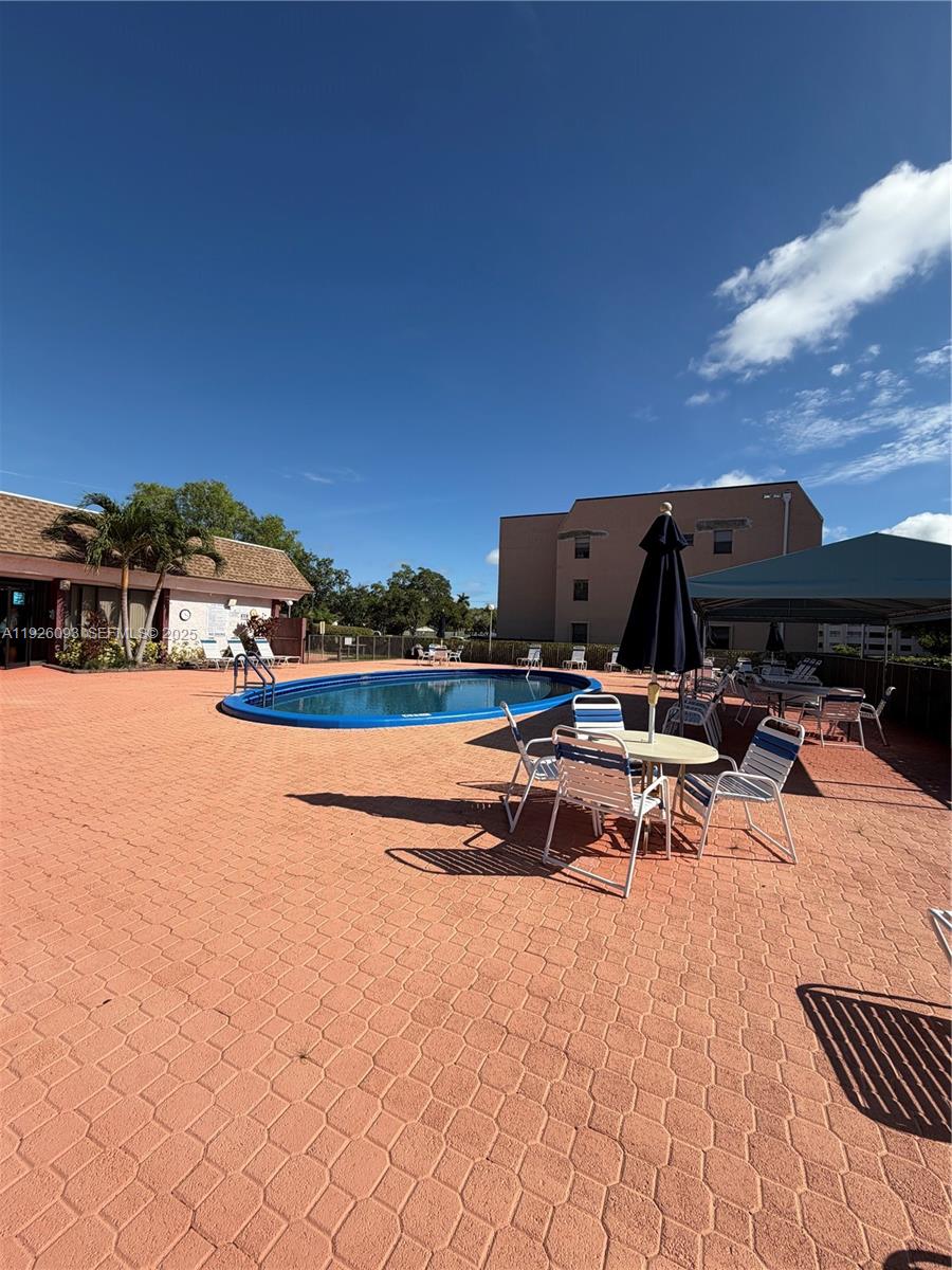 10360 Northwest 30th Court, Unit 204 Sunrise, FL 33322 - Photo 3 of 24 a view of swimming pool with lounge chair