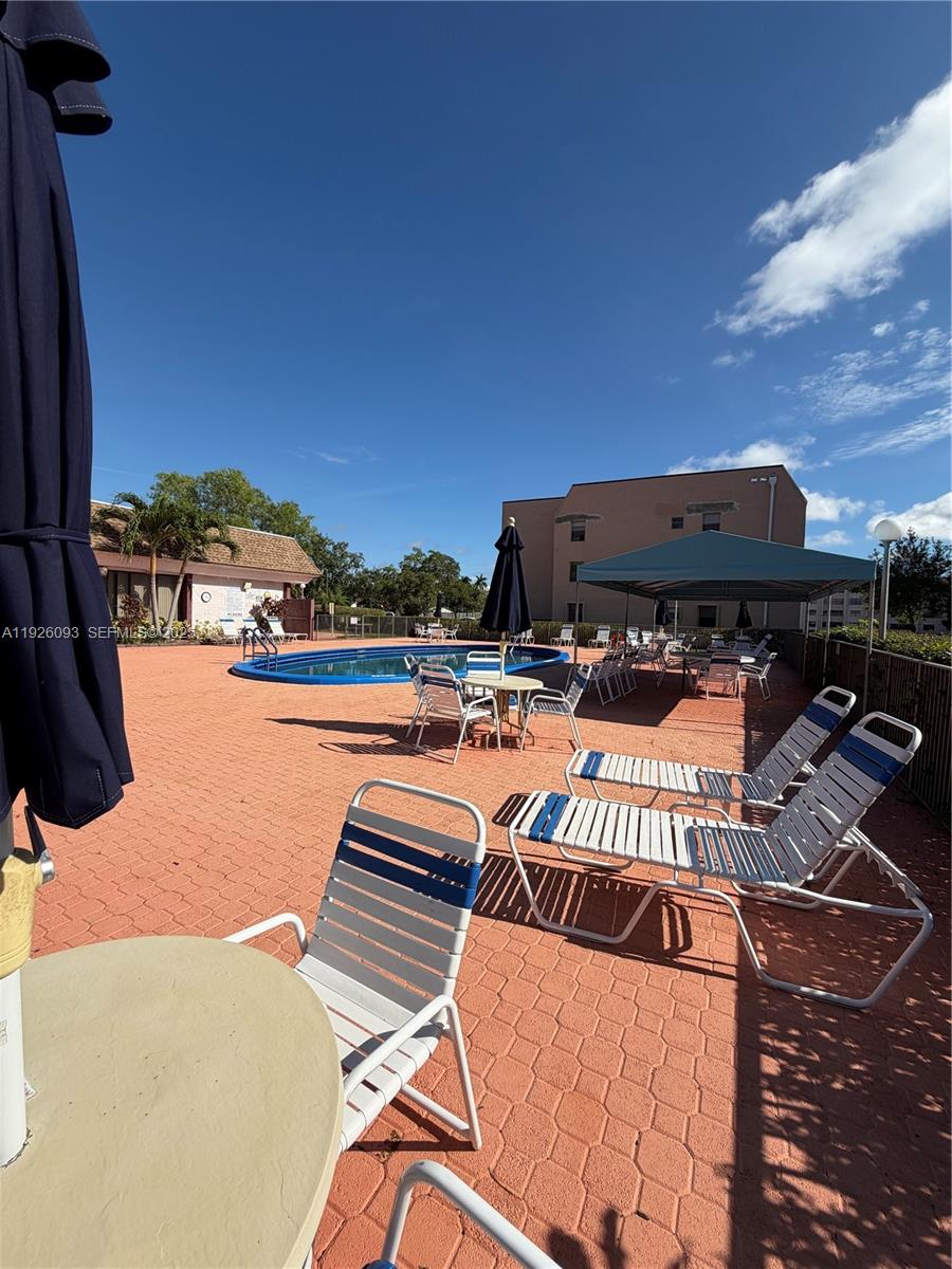 10360 Northwest 30th Court, Unit 204 Sunrise, FL 33322 - Photo 5 of 24 a outdoor view with a sitting space