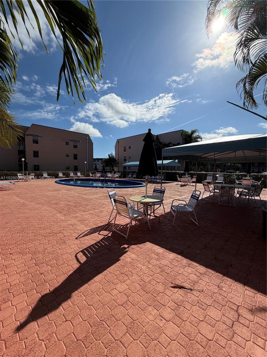 10360 Northwest 30th Court, Unit 204 Sunrise, FL 33322 - Photo 7 of 24 a view of outdoor space with seating area