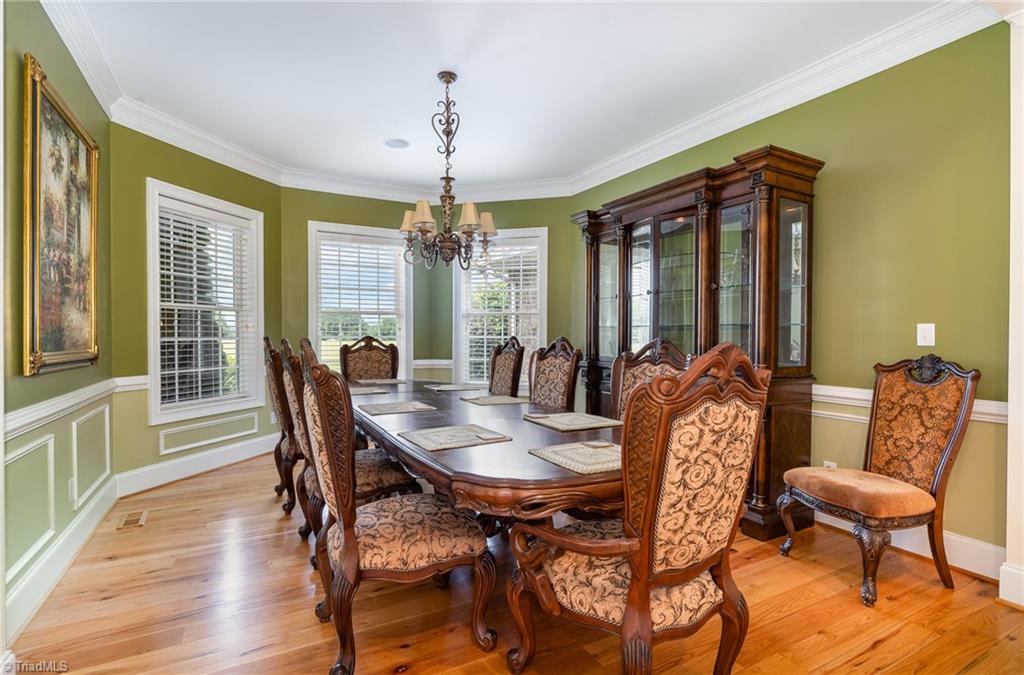 2250 Bethel Church Road Pleasant Garden, NC 27313 - Photo 16 of 45 Elegant dining room filled with natural light, perfect for dinner parties with a refined charm and timeless style