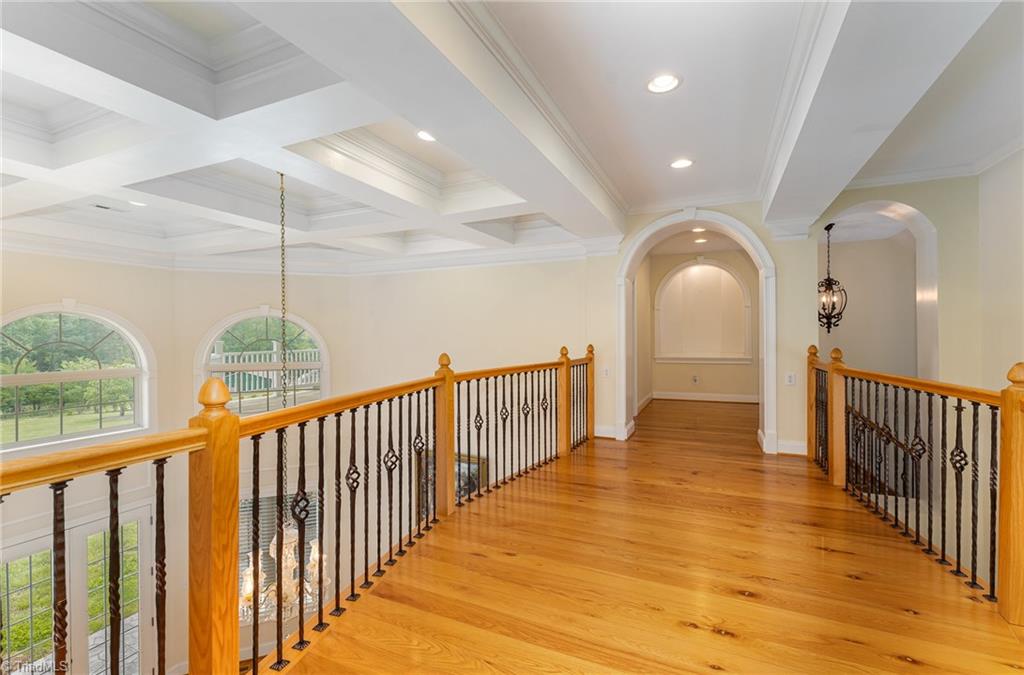 2250 Bethel Church Road Pleasant Garden, NC 27313 - Photo 24 of 45 Bright and spacious upstairs hallway connecting bedrooms with plenty of natural light and tasteful finishes, adding to the home’s open flow.