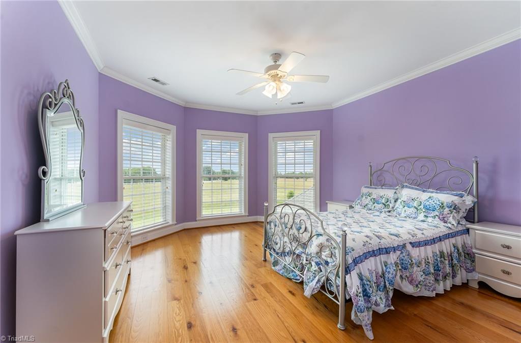 2250 Bethel Church Road Pleasant Garden, NC 27313 - Photo 28 of 45 right and airy third bedroom filled with abundant natural light, creating a warm and inviting space