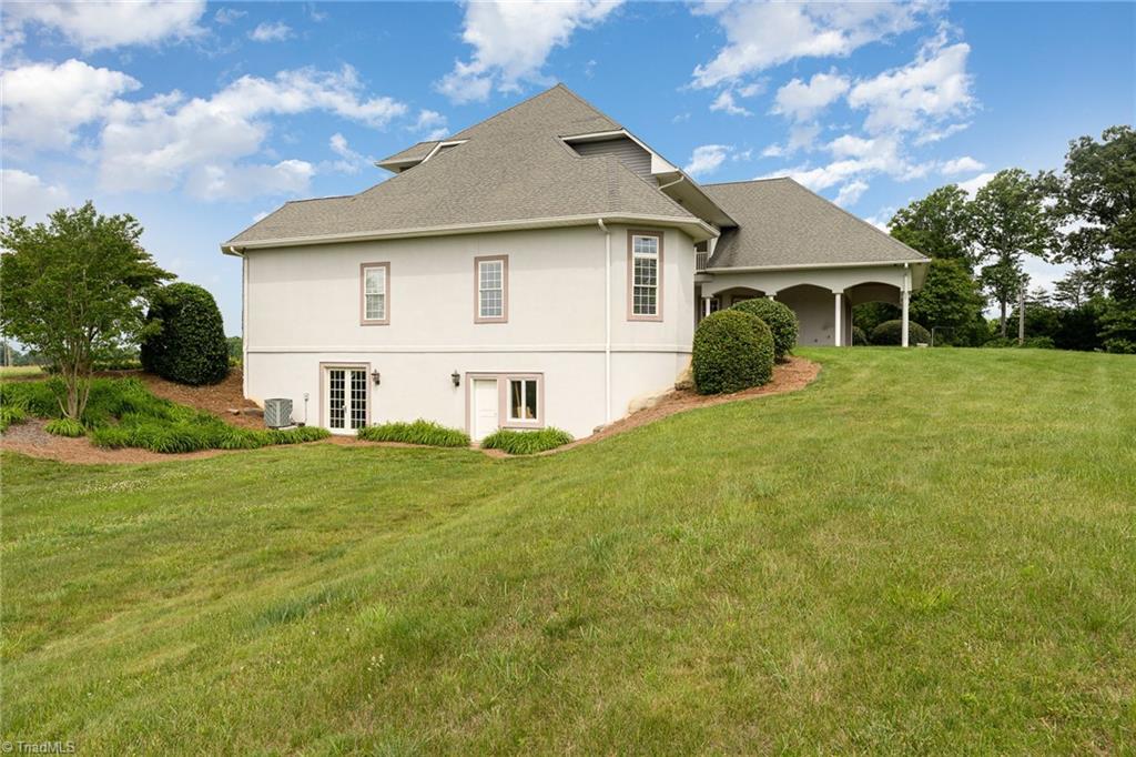 2250 Bethel Church Road Pleasant Garden, NC 27313 - Photo 40 of 45 Basement with convenient outdoor access, offering versatile space and easy entry